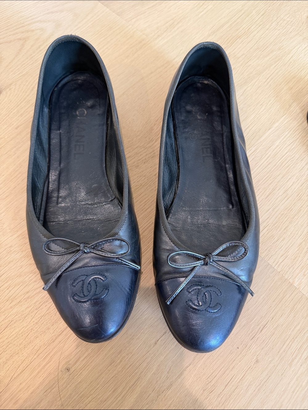 CHANEL Black Leather Cap-Toe Ballet Flats with Bow and CC Logo
